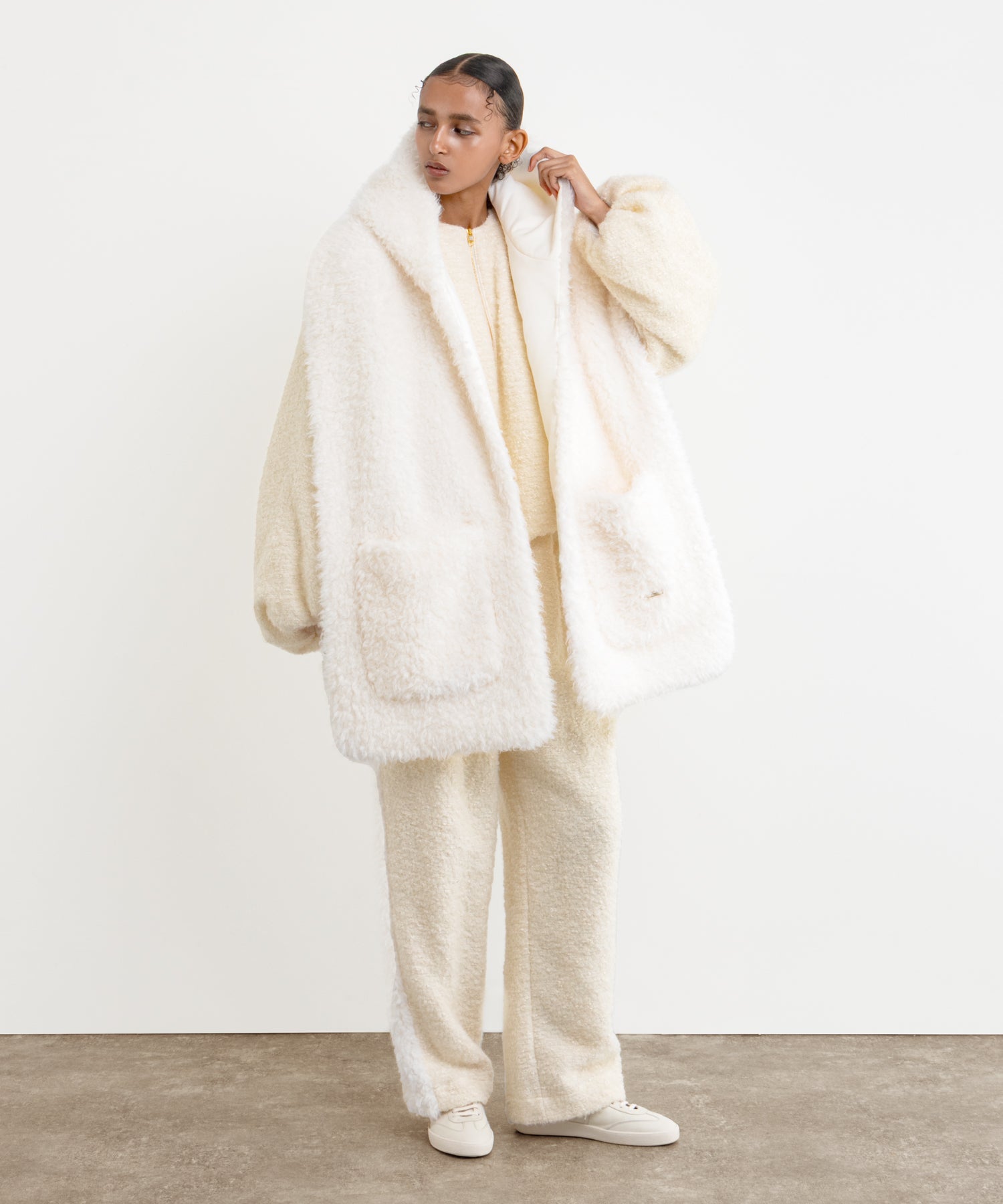 The model is 177 cm tall and is wearing a free size in White.